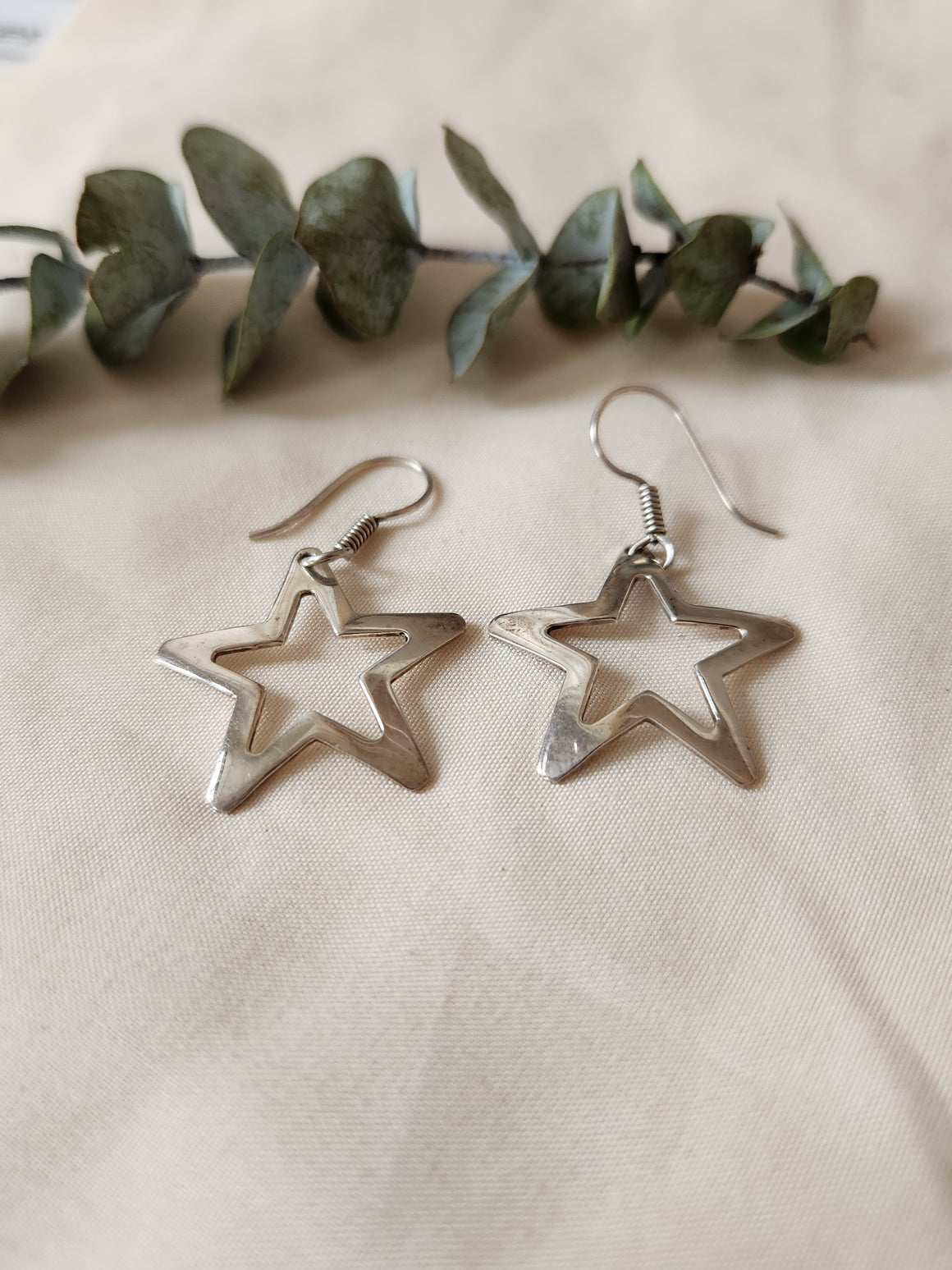 Sterling silver open star drop earrings