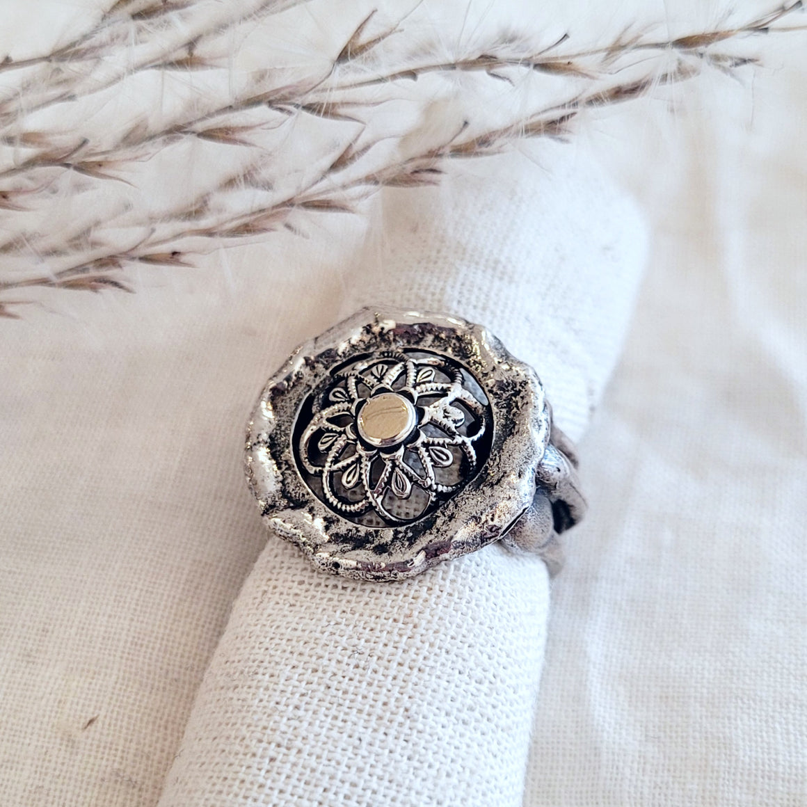 Sterling silver open floral band with gold dot centre
