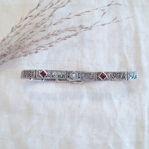 Sterling silver filigree link garnet and colourless sapphire set bracelet