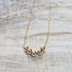 10k yellow gold beaded necklace with 5 gold balls