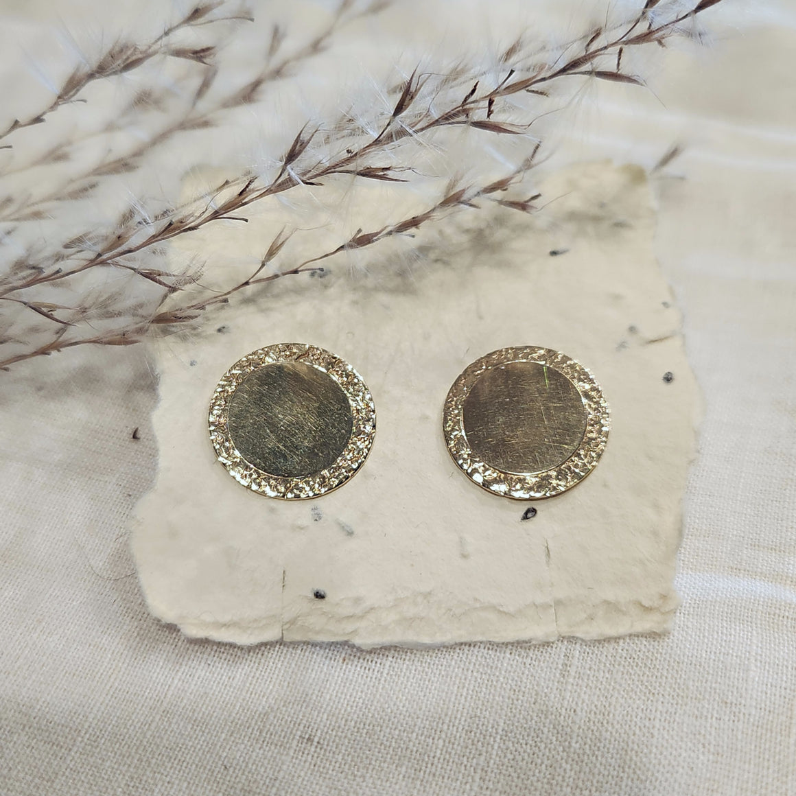 14k yellow gold disc stud earrings with textured border