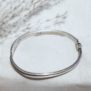 Sterling silver and 14k yellow gold overlay hinged bangle bracelet