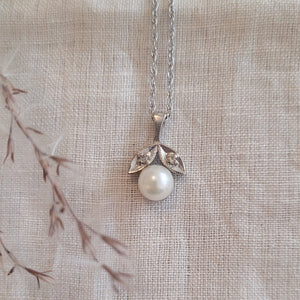 10k white gold cultured pearl and diamond pendant and silver chain